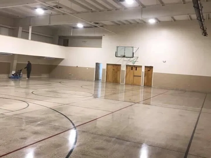 Sealed concrete floor with court lines in a gym, polished concrete floors
