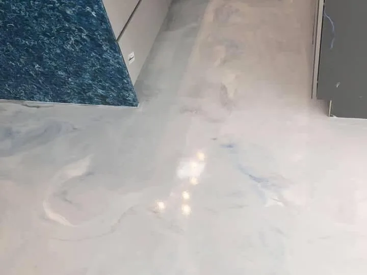 White and blue metallic epoxy floor in a kitchen, polished concrete and epoxy floors